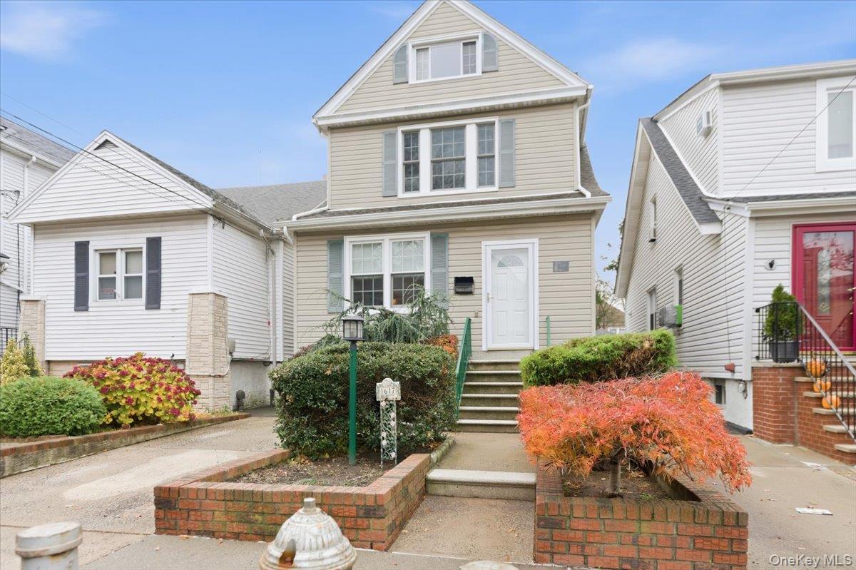 1617 Mahan Avenue Bronx, NY 10461 - Photo 1 of 29 a front view of a house with garden