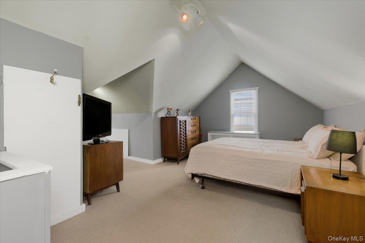 1617 Mahan Avenue Bronx, NY 10461 - Photo 16 of 29 a bedroom with bed and flat tv