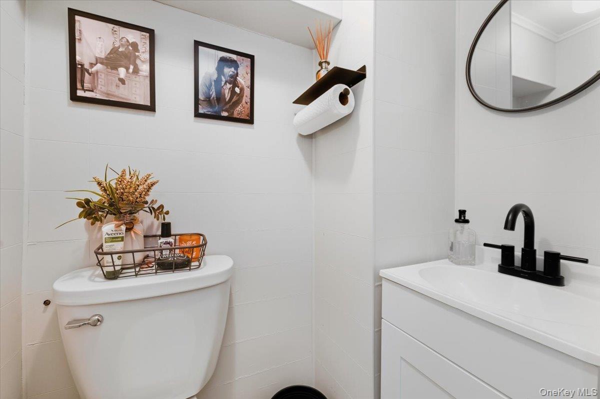 1617 Mahan Avenue Bronx, NY 10461 - Photo 20 of 29 a bathroom with a sink and a mirror