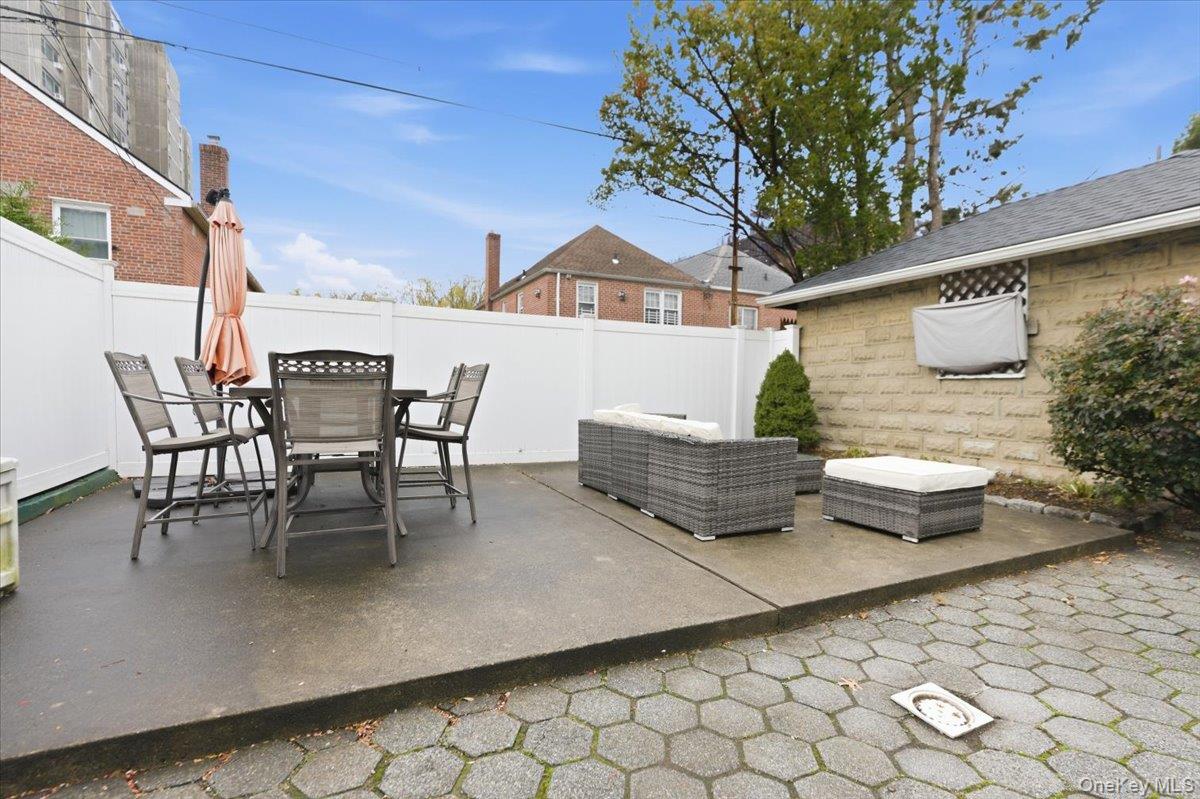 1617 Mahan Avenue Bronx, NY 10461 - Photo 22 of 29 a view of a patio with table and chairs