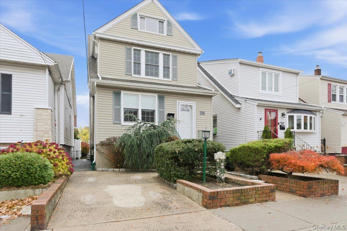 1617 Mahan Avenue Bronx, NY 10461 - Photo 24 of 29 a front view of a house with garden