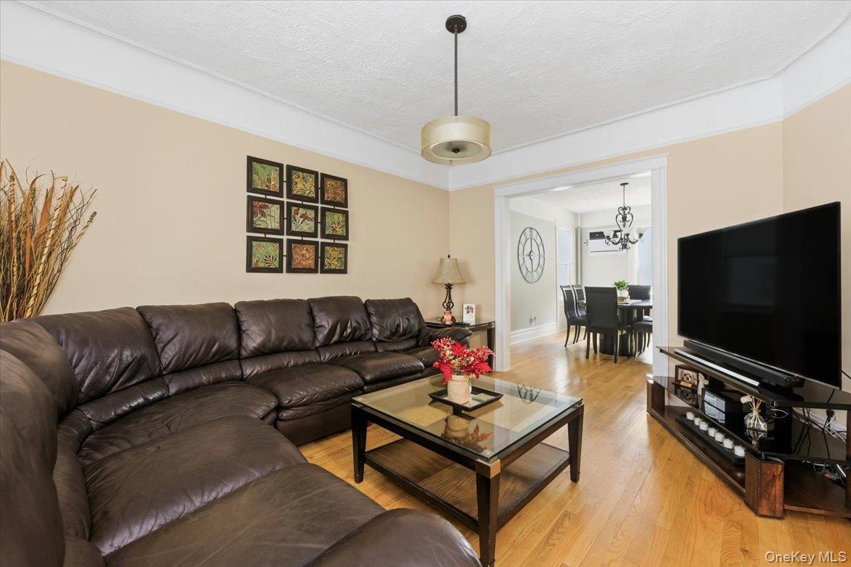 1617 Mahan Avenue Bronx, NY 10461 - Photo 5 of 29 a living room with furniture and a flat screen tv