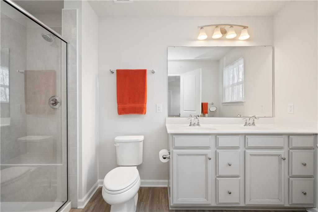 238 Frances Lane McDonald, PA 15057 - Photo 14 of 30 a bathroom with a toilet a sink a vanity a mirror and shower