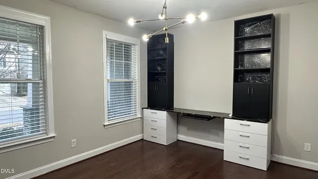 a kitchen with kitchen island stainless steel appliances a sink stove and refrigerator