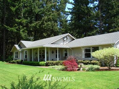 17528 Albany Street Southwest Rochester, WA 98579 - Photo 1 of 1 a front view of a house with garden