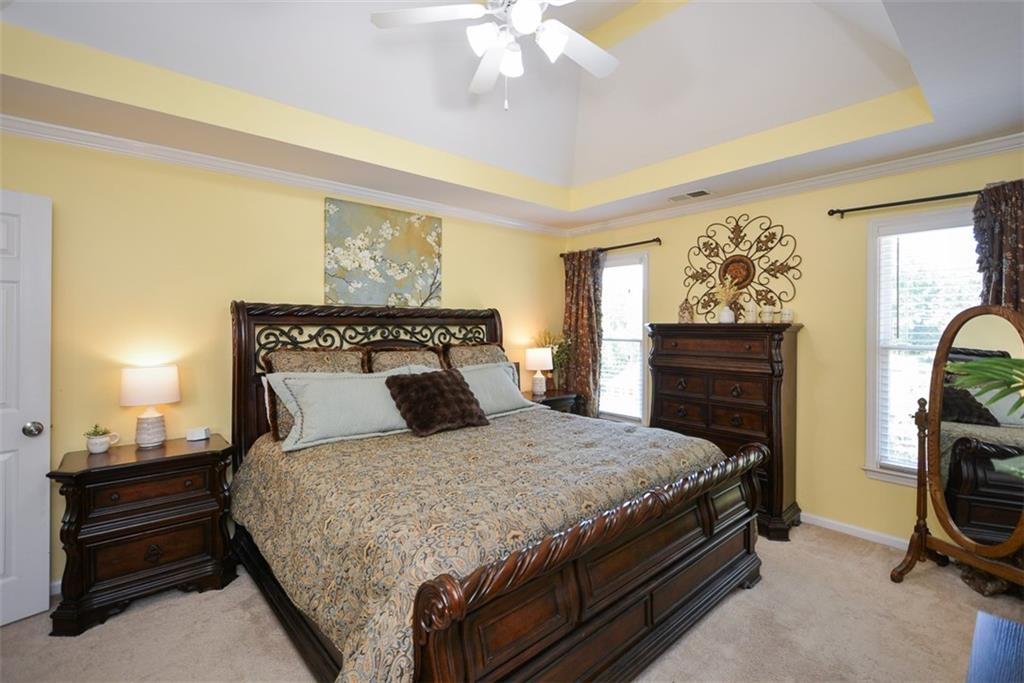 10 Arbor Hills Road South Talking Rock, GA 30175 - Photo 44 of 89 a bedroom with a bed and a chandelier