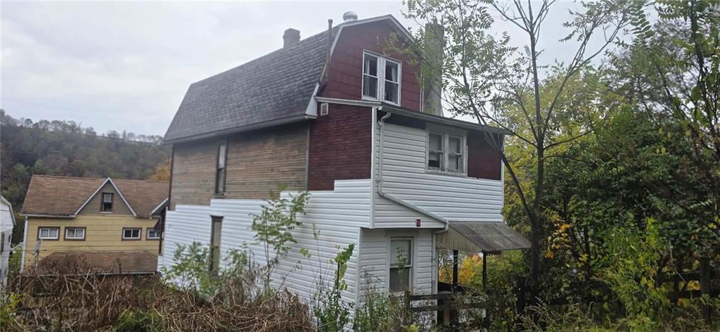 1134 Ridge Avenue Johnstown, PA 15901 - Photo 2 of 9 a front view of a house with a garden