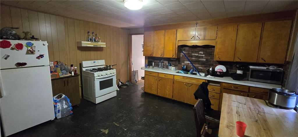 1134 Ridge Avenue Johnstown, PA 15901 - Photo 3 of 9 a kitchen with a refrigerator stove and sink