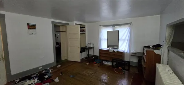 a bathroom with a window and a shower