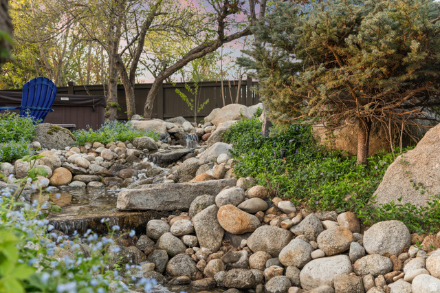 10280 Dimple Dell Road Sandy, UT 84092 - Photo 22 of 58 View of private river and bridge located inside fenced backyard
