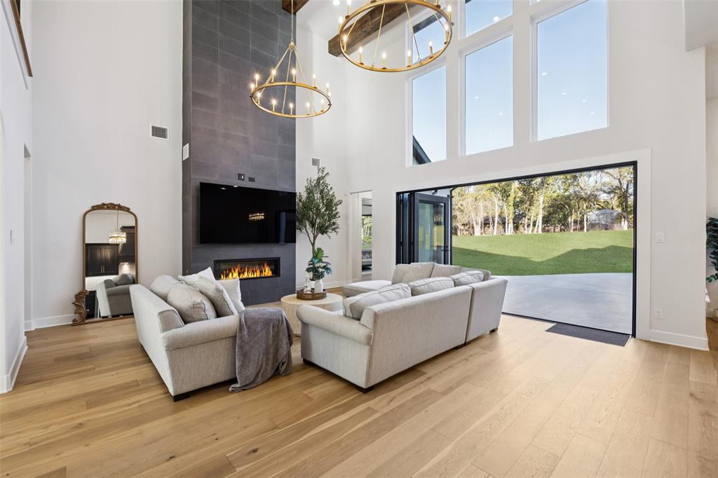 4120 Ridgecrest Drive Flower Mound, TX 75022 - Photo 12 of 40 a living room with fireplace furniture and a flat screen tv