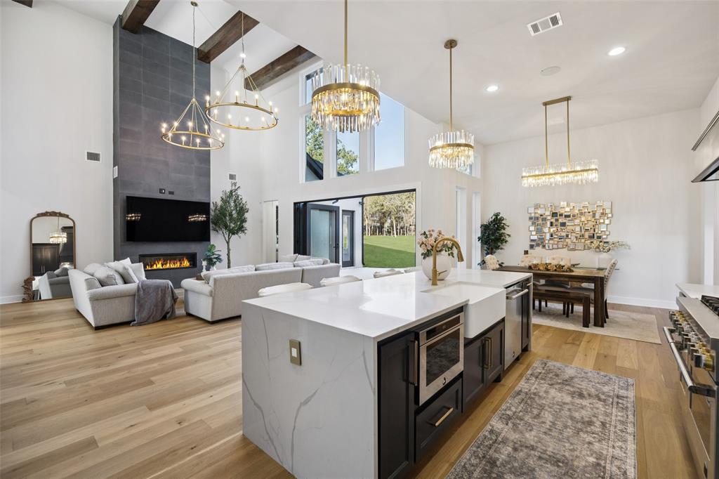 4120 Ridgecrest Drive Flower Mound, TX 75022 - Photo 14 of 40 a kitchen with a stove oven and a table