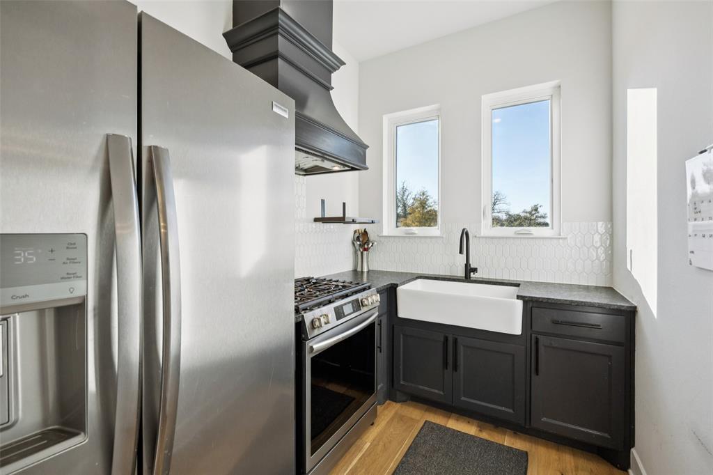 4120 Ridgecrest Drive Flower Mound, TX 75022 - Photo 16 of 40 a kitchen with a sink appliances and cabinets