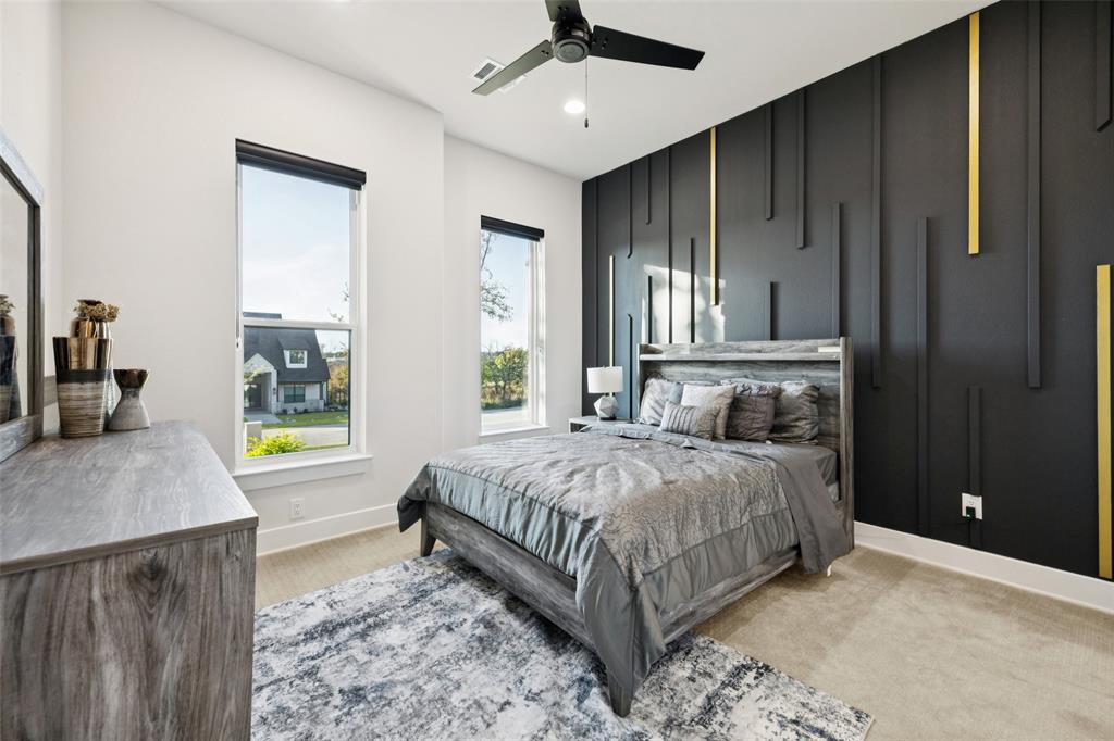 4120 Ridgecrest Drive Flower Mound, TX 75022 - Photo 28 of 40 a bedroom with a bed and a dresser with mirror