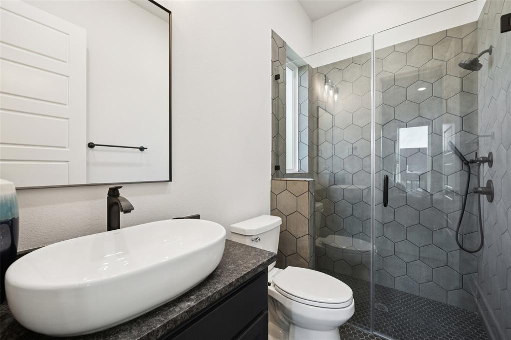 4120 Ridgecrest Drive Flower Mound, TX 75022 - Photo 29 of 40 a bathroom with a sink and toilet