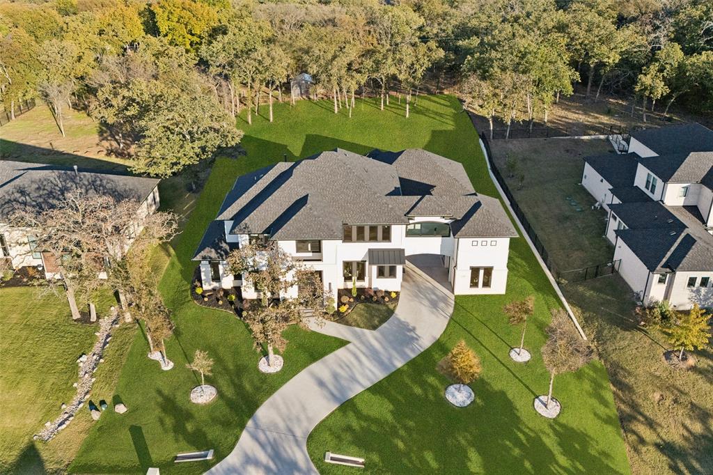 4120 Ridgecrest Drive Flower Mound, TX 75022 - Photo 3 of 40 an aerial view of a house with garden space sitting space and swimming pool