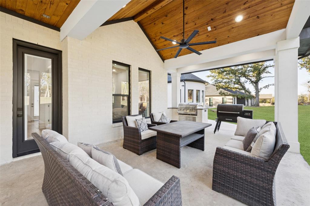 4120 Ridgecrest Drive Flower Mound, TX 75022 - Photo 33 of 40 a living room with furniture a table and chairs