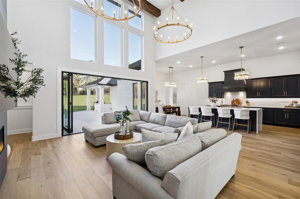 4120 Ridgecrest Drive Flower Mound, TX 75022 - Photo 8 of 40 a living room with furniture kitchen view and a large window
