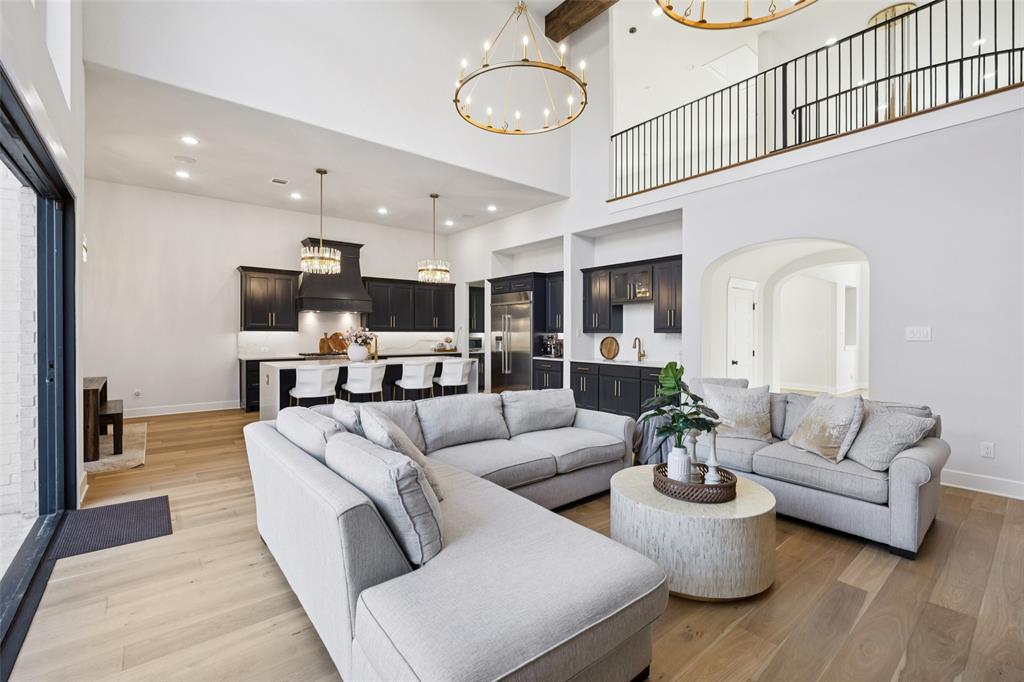 4120 Ridgecrest Drive Flower Mound, TX 75022 - Photo 10 of 40 a living room with furniture kitchen view and a chandelier