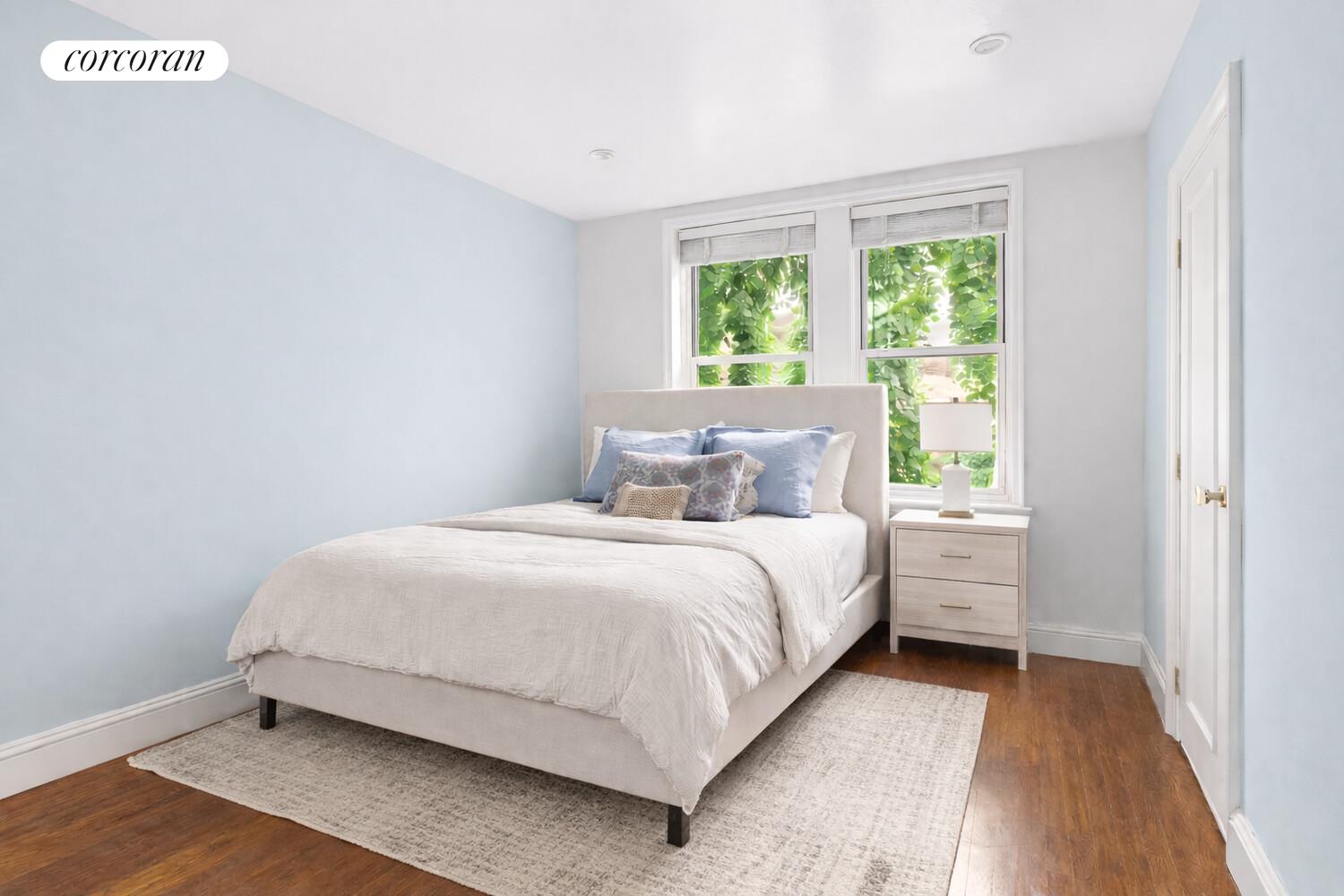 519 East 86th Street, Unit 6D Manhattan, NY 10028 - Photo 10 of 19 a bedroom with a bed and a window