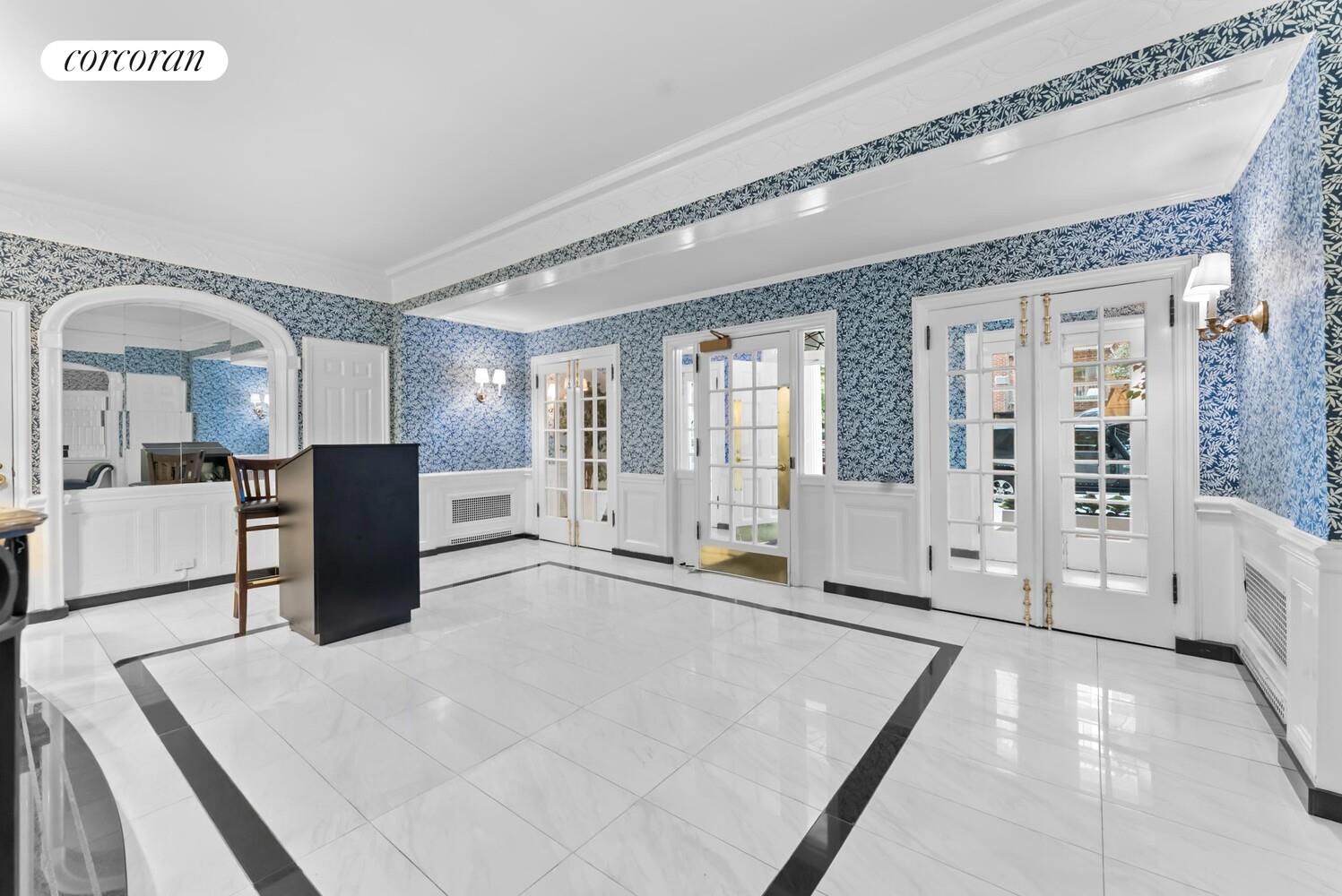 519 East 86th Street, Unit 6D Manhattan, NY 10028 - Photo 17 of 19 a spacious bathroom with a granite countertop sink mirror and vanity
