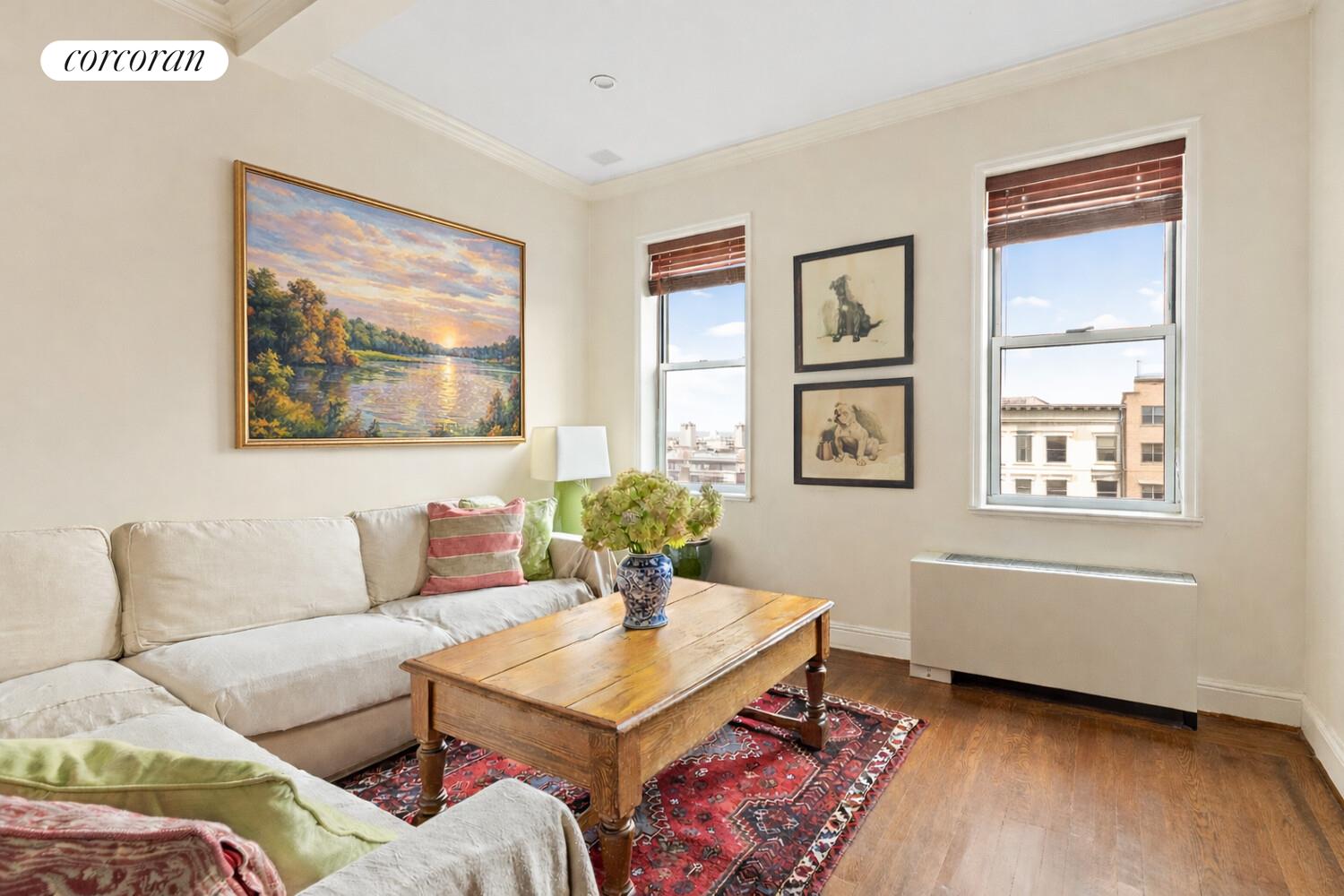 519 East 86th Street, Unit 6D Manhattan, NY 10028 - Photo 4 of 19 a living room with furniture and window