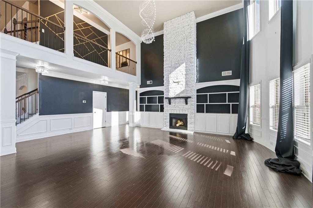 2813 Carrick Court Powder Springs, GA 30127 - Photo 16 of 47 a view of a living room with furniture and a floor to ceiling window