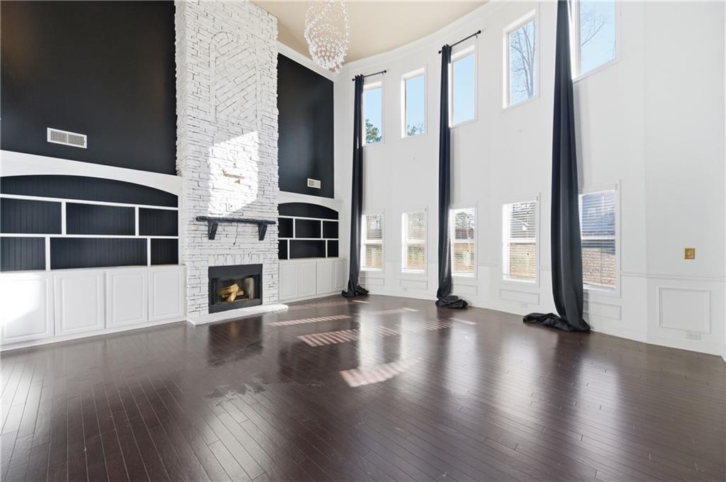 2813 Carrick Court Powder Springs, GA 30127 - Photo 17 of 47 a view of an empty room with wooden floor and a window