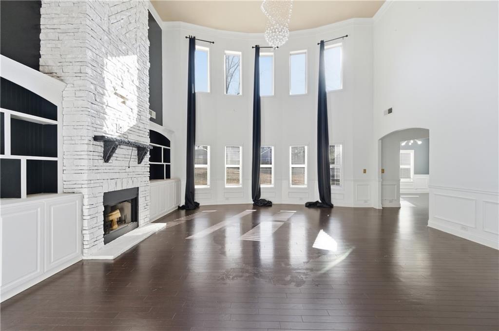 2813 Carrick Court Powder Springs, GA 30127 - Photo 19 of 47 a view of an empty room with fireplace and wooden floor