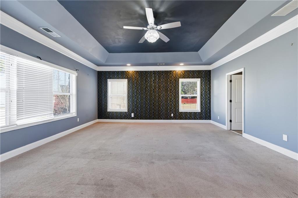 2813 Carrick Court Powder Springs, GA 30127 - Photo 22 of 47 a view of an empty room with a window and a kitchen