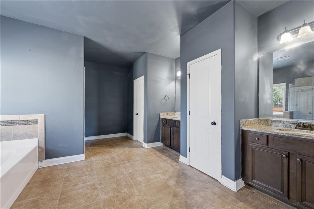 2813 Carrick Court Powder Springs, GA 30127 - Photo 28 of 47 a view of a hallway to rooms