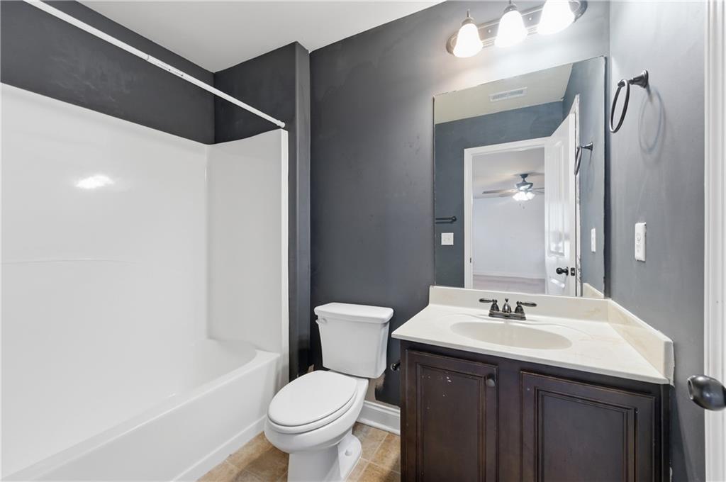 2813 Carrick Court Powder Springs, GA 30127 - Photo 37 of 47 a bathroom with a sink toilet and shower