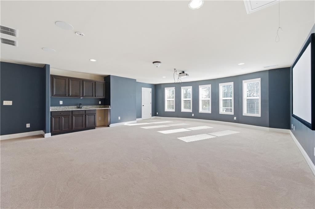 2813 Carrick Court Powder Springs, GA 30127 - Photo 39 of 47 a view of an empty room with a window and a kitchen