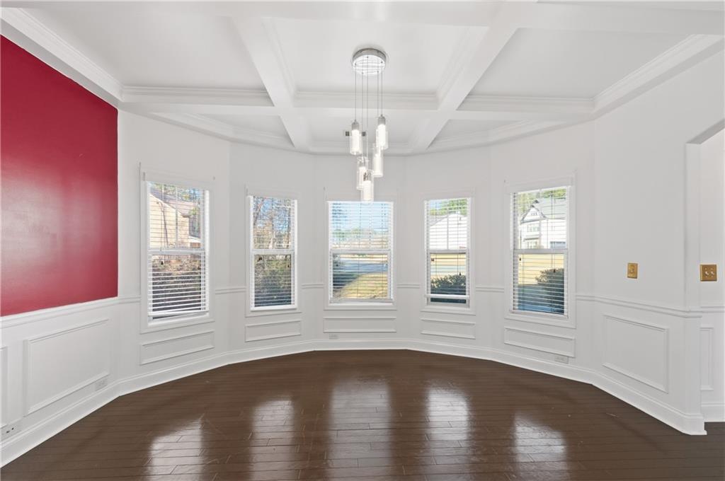 2813 Carrick Court Powder Springs, GA 30127 - Photo 6 of 47 a view of an empty room with wooden floor and a window