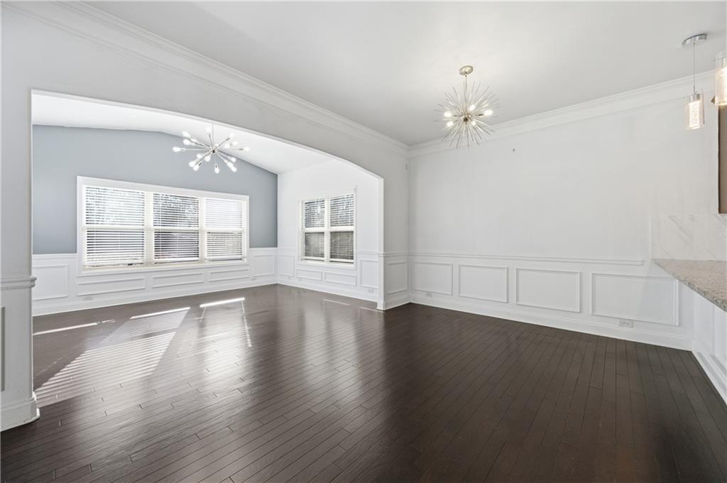 2813 Carrick Court Powder Springs, GA 30127 - Photo 8 of 47 a view of an empty room with wooden floor and a window