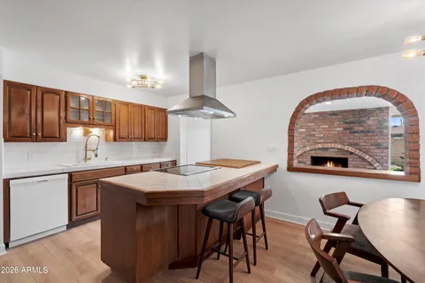 a kitchen with a stove and a refrigerator
