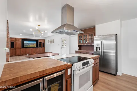 a kitchen with a stove and a stove top oven