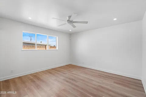 a view of hallway with wooden floor