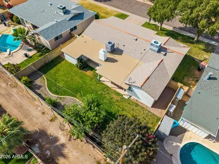 an aerial view of residential houses with outdoor space