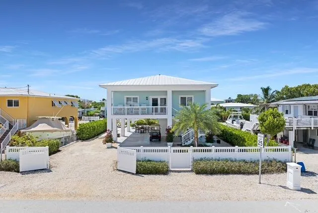 front view of a house with potted plants