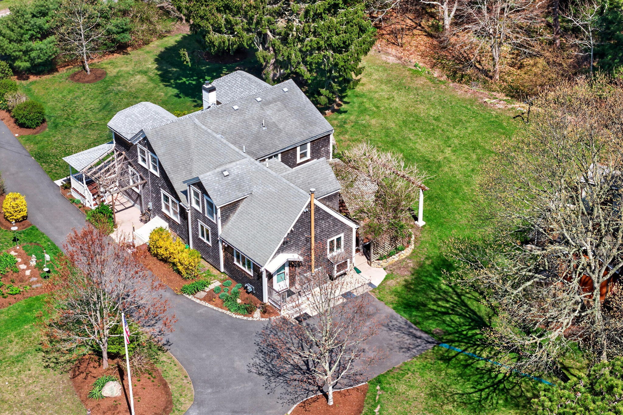 69 County Road Bourne, MA 02532 - Photo 6 of 54 an aerial view of a house with a yard