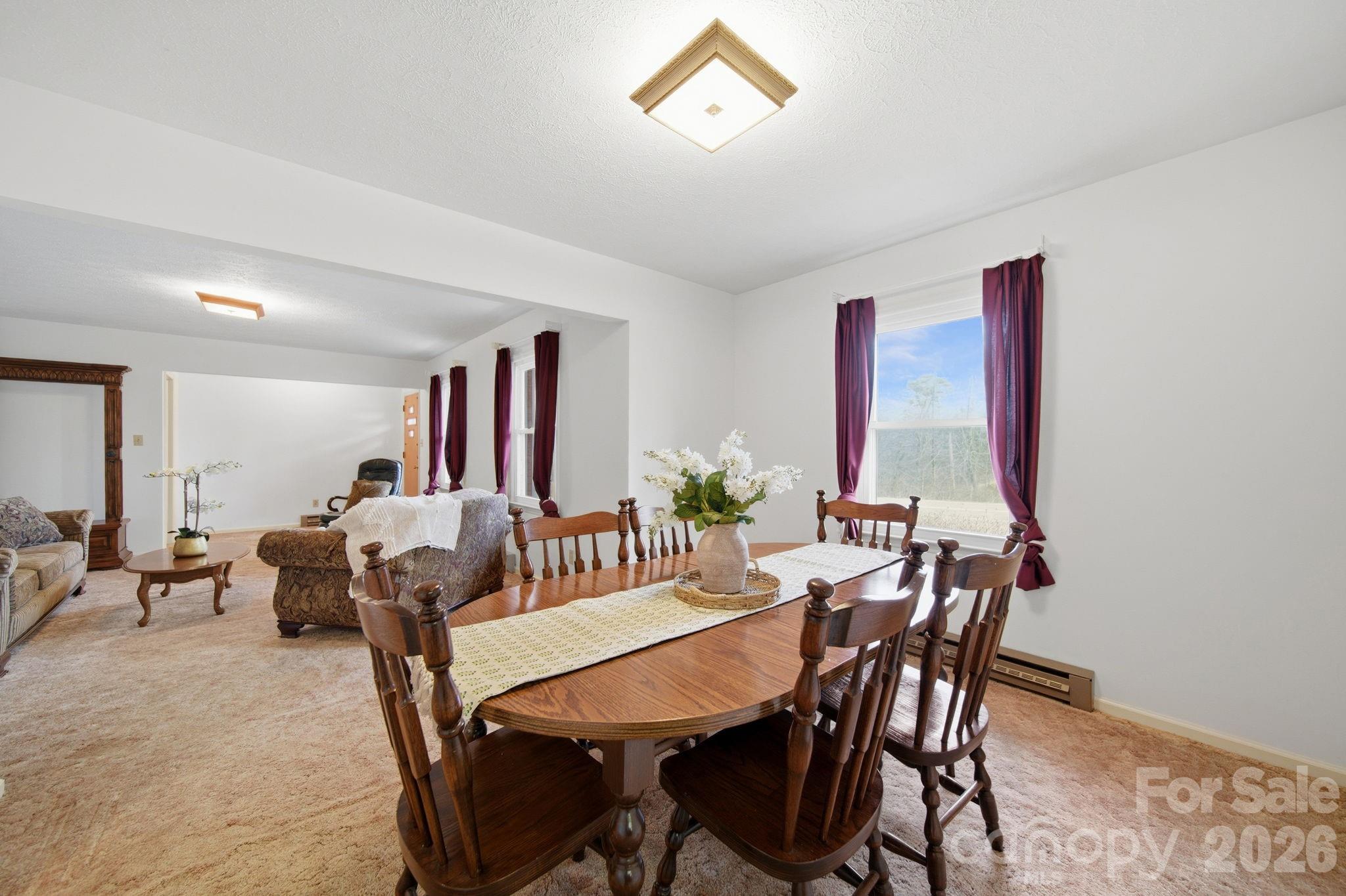 6418 Casar Road Casar, NC 28020 - Photo 11 of 38 a view of a dining room with furniture and a window