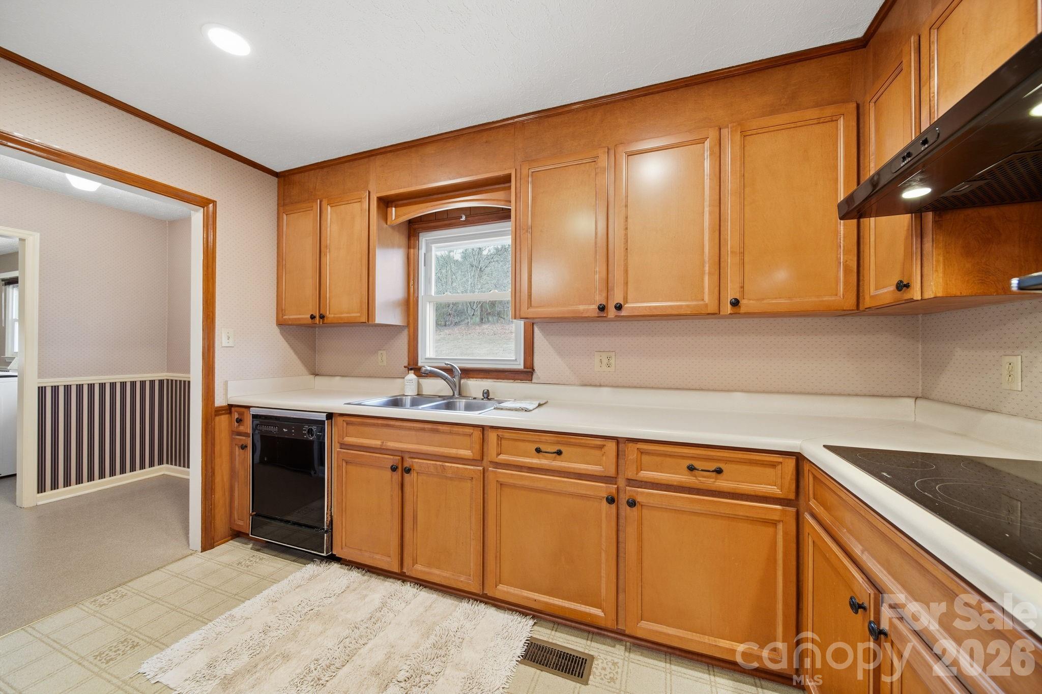 6418 Casar Road Casar, NC 28020 - Photo 19 of 38 a kitchen with stainless steel appliances granite countertop a sink and cabinets