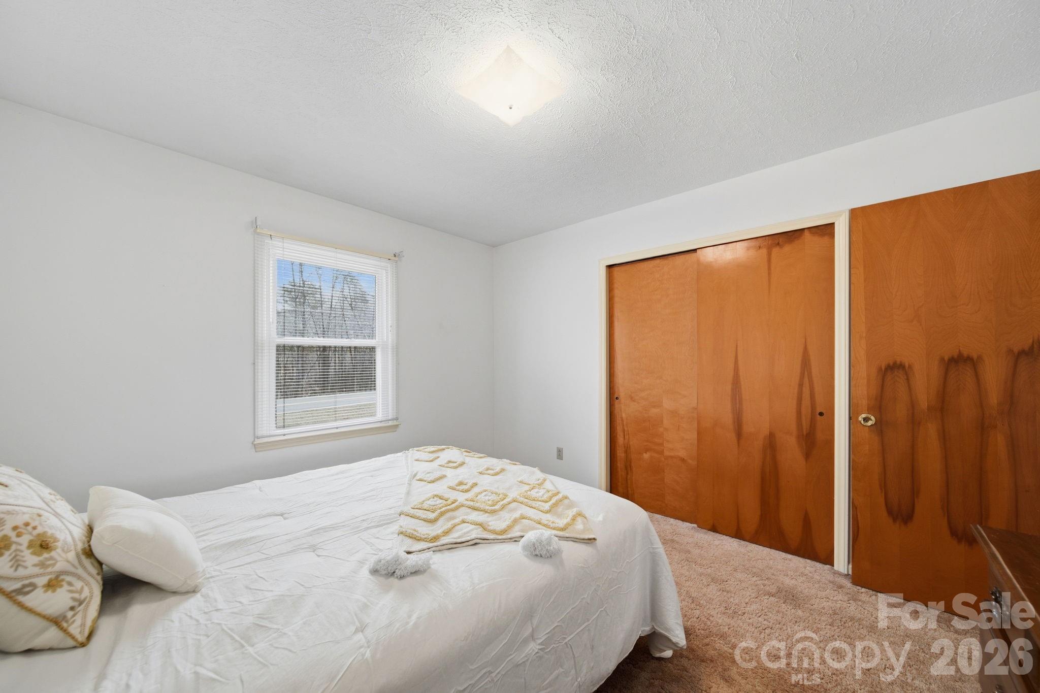 6418 Casar Road Casar, NC 28020 - Photo 25 of 38 a bedroom with a bed and a window