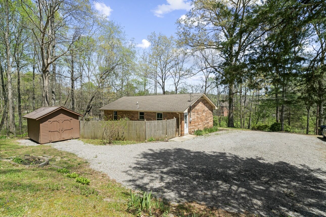 7704 Chester Road Fairview, TN 37062 - Photo 13 of 19 a view of a house with a yard covered in snow