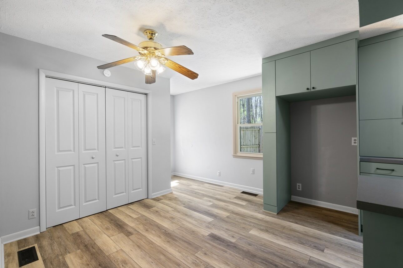 7704 Chester Road Fairview, TN 37062 - Photo 15 of 19 a view of an empty room with window and wooden floor