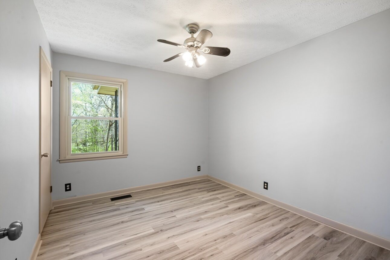 7704 Chester Road Fairview, TN 37062 - Photo 16 of 19 wooden floor in an empty room with a window