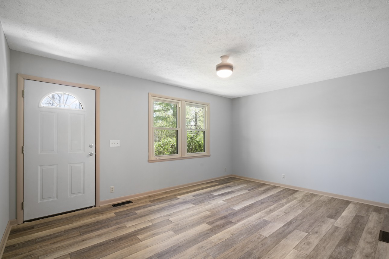 7704 Chester Road Fairview, TN 37062 - Photo 9 of 19 wooden floor in an empty room with a window