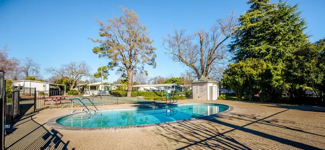 a view of a swimming pool with a patio