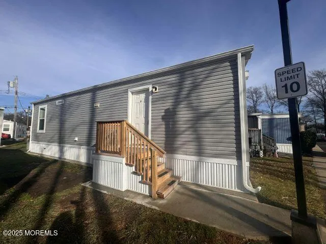a view of a porch with wooden floor and fence